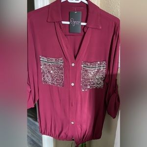 Red shirt with sparkle pockets.